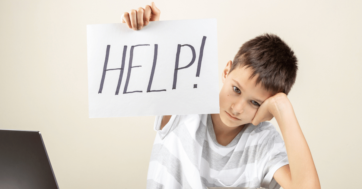 Sad child struggling with online Quran class holding a help sign — representing kids who feel overwhelmed or uninterested in Quran lessons