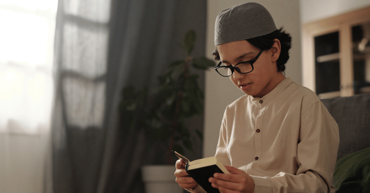Child reading the Quran correctly with focus and proper pronunciation