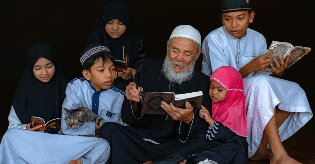 Scholar teaching the Quran to children of different ages, showing that the best age to start learning Quran depends on readiness, guidance, and approach